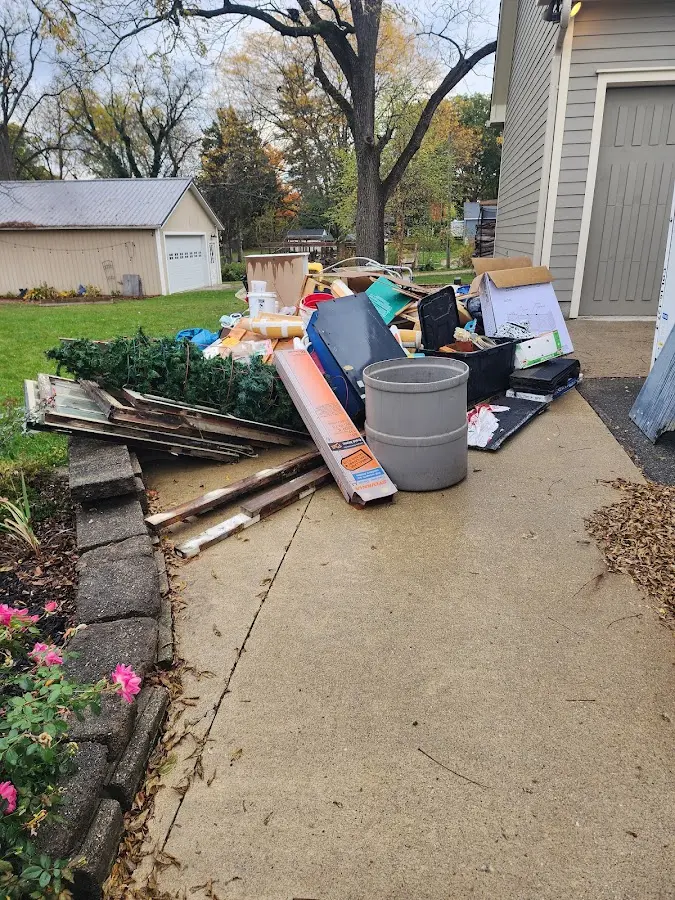 Dumpster being loaded with debris for Commercial Dumpster Rental in Lake Magdalene